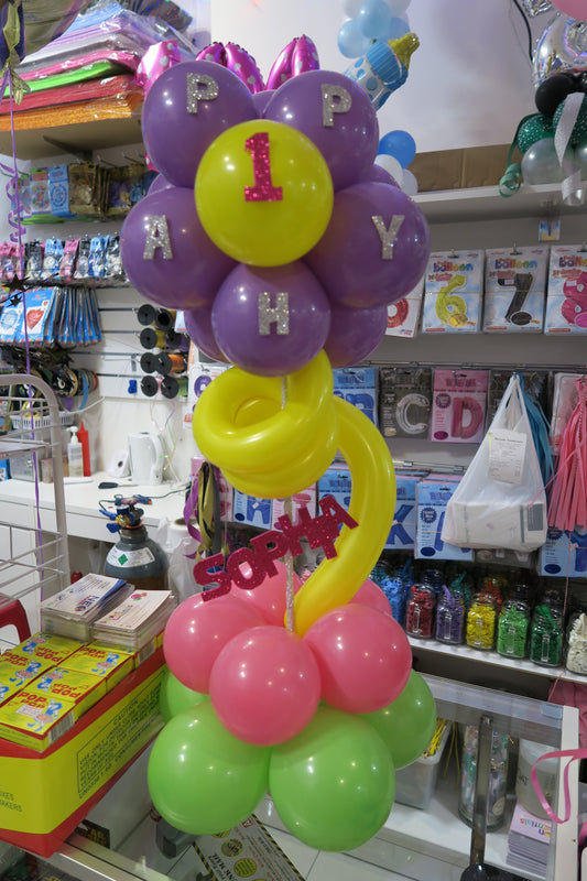 1st birthday with Name topiary table arrangement