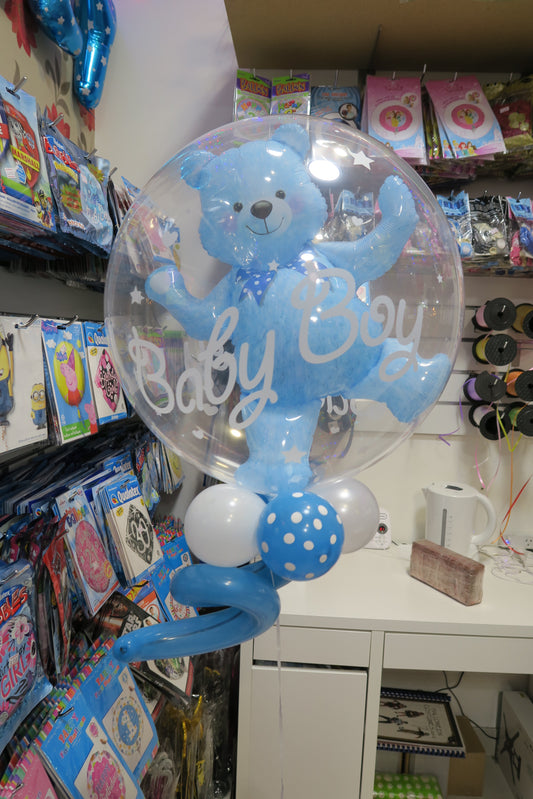 Clear bubble with teddy bear inside and 9 helium balloon bouquet