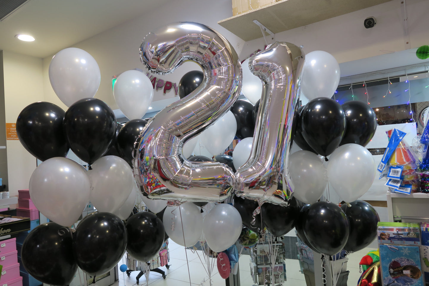 21 foil number and 40 helium balloons