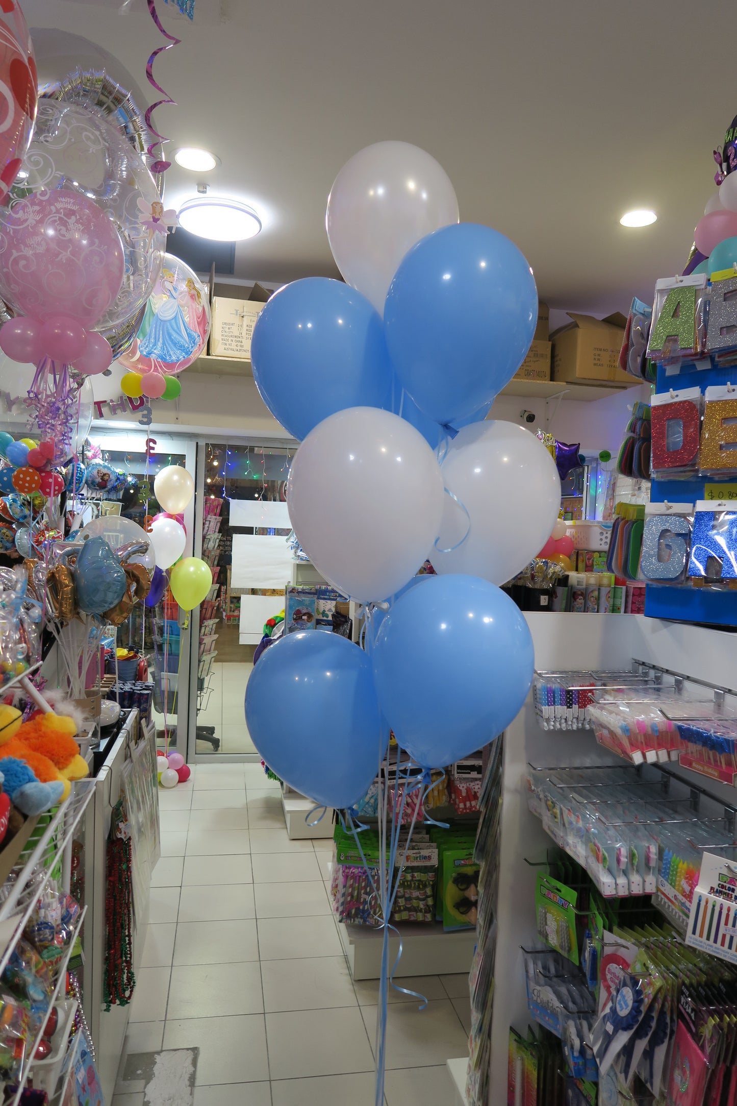 Clear bubble with teddy bear inside and 9 helium balloon bouquet
